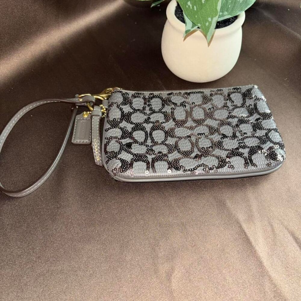 Coach grey and black wristlet with sequins excellent condition no callouts